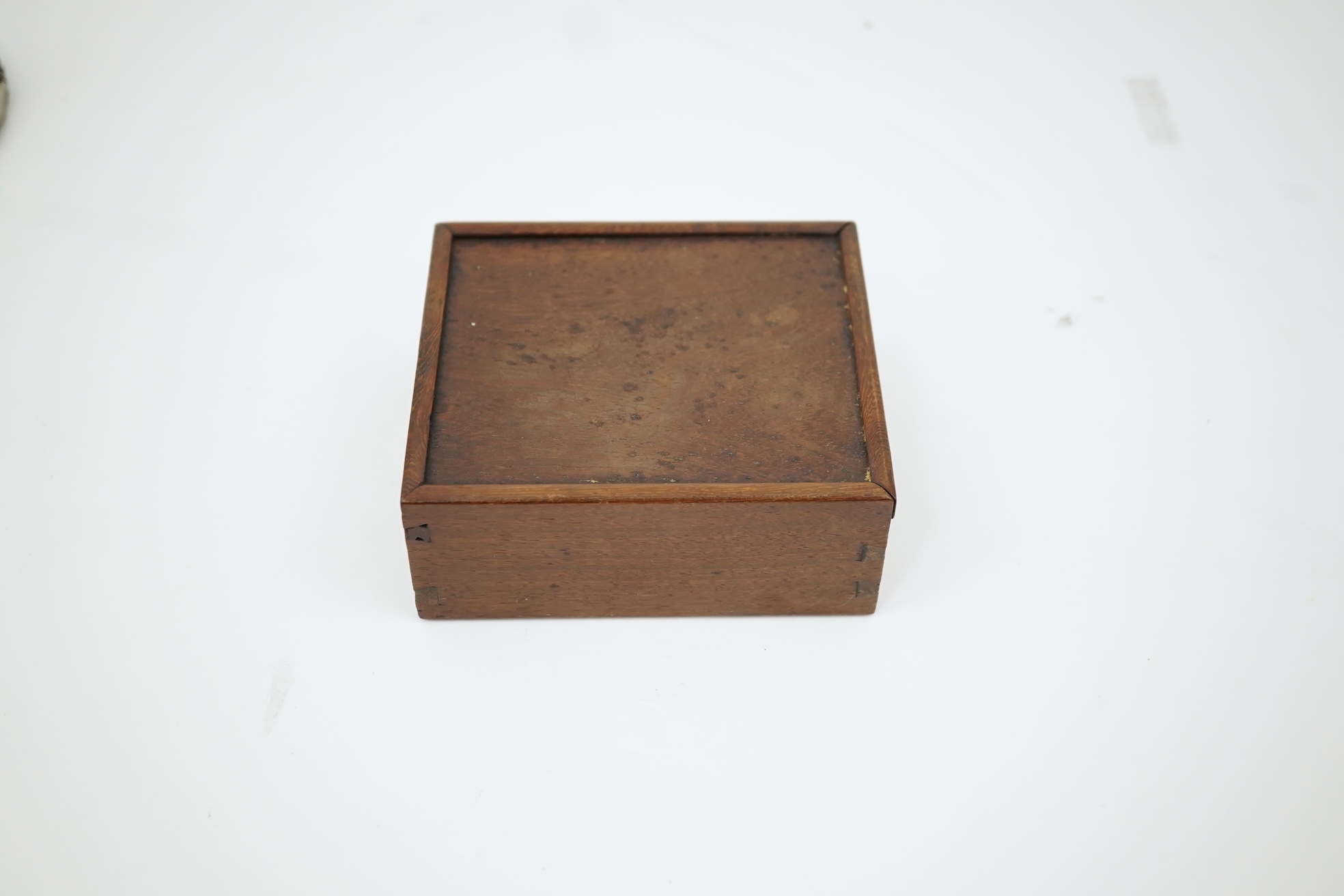 A cased pair of Chinese hardwood ‘lion-dog’ seals, early 20th century